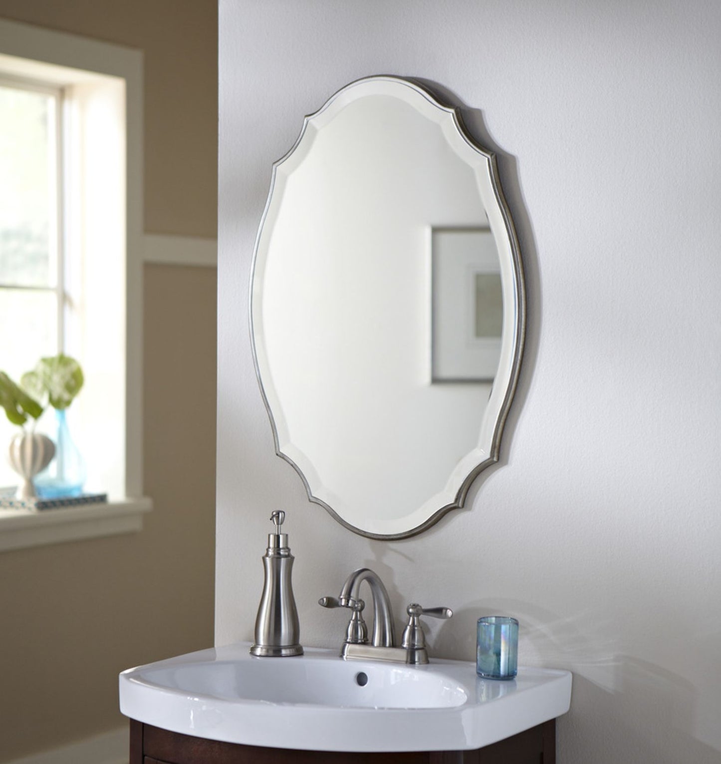 Lily Lifestyle Shaped Beveled Mirror Accented With A Rounded Edged Frame, With Burnished Silver Finish